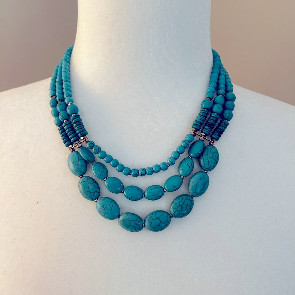 Turquoise-hued + gold tone, statement necklace.